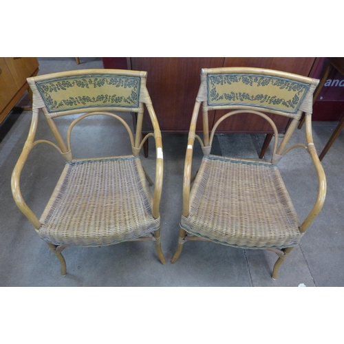 36 - A pair of Italian bamboo and rattan elbow chairs