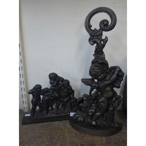 361 - A cast iron figural Cherub of Vines door stop and a Fable of The Golden Goose door stop