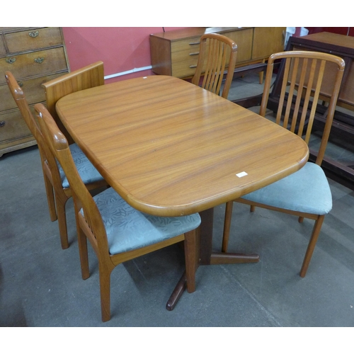 37 - A Danish Ansagar Mobler teak extending dining table and four chairs