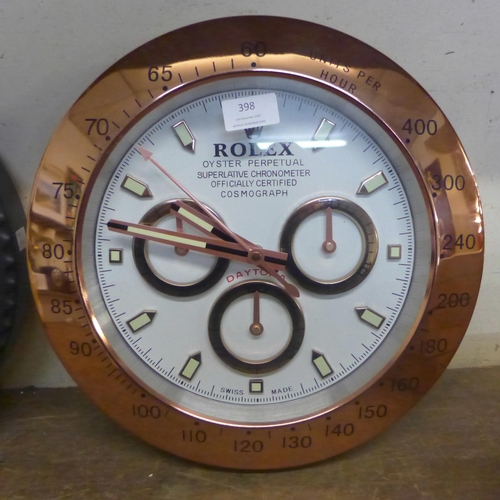 398 - A Rolex style dealers circular wall clock