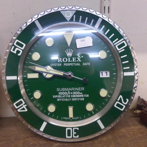 399 - A Rolex style dealers circular wall clock