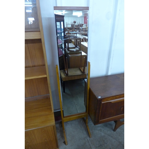 51 - A teak asymmetrical framed mirror and a cheval mirror