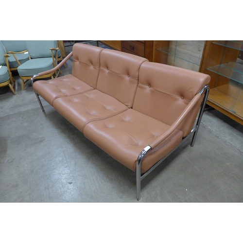 66 - A Pieff chrome and tan leather settee