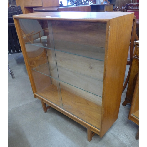 76 - A Turnidge of London teak display cabinet