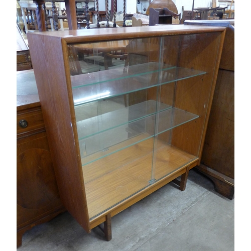 77 - A Turnidge of London teak display cabinet