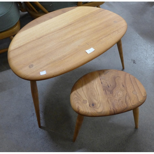 8 - An Ercol elm and beech pebble shaped nest of two tables