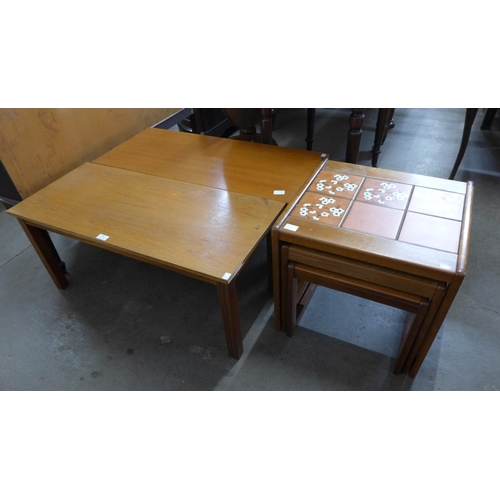 84 - A pair of teak coffee tables and a tiled top nest of tables