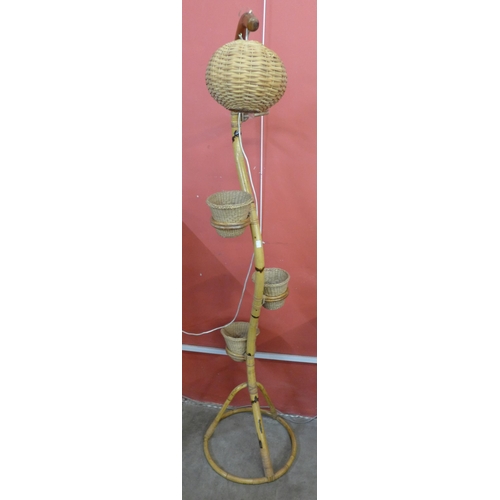 84A - A bamboo snake shaped floor standing lamp/plant stand