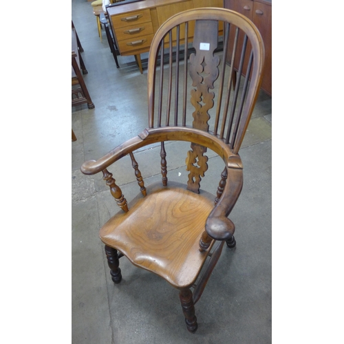 92 - A 19th Century elm and yew wood highback Windsor chair