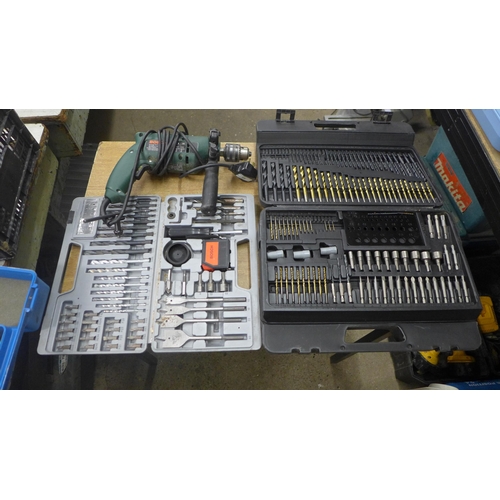 2075 - A Bosch CSB 500-2) hammer drill, a Bosch drill set, another drill set and a large drill bit