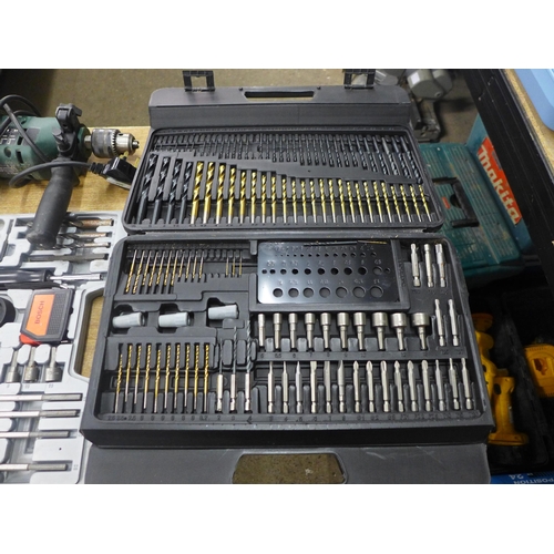 2075 - A Bosch CSB 500-2) hammer drill, a Bosch drill set, another drill set and a large drill bit