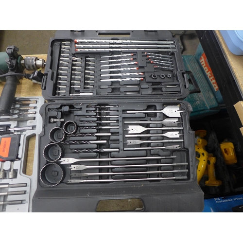 2075 - A Bosch CSB 500-2) hammer drill, a Bosch drill set, another drill set and a large drill bit