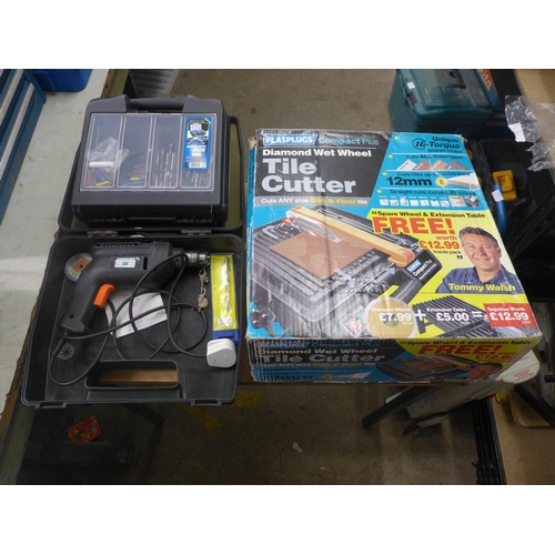 2080 - A diamond wet wheel tile cutter, a Black & Decker D562/H1 drill and a box of wall pugs and drill bit... 