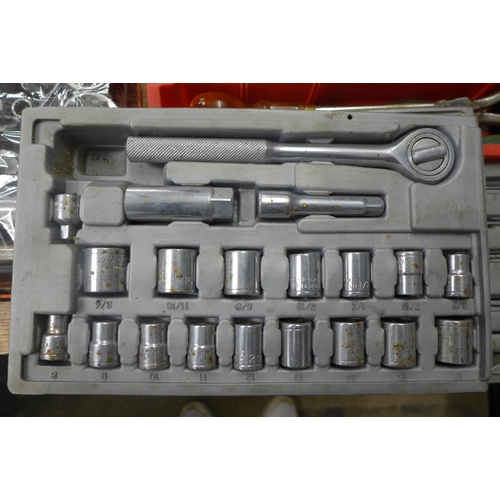 2081 - A metal tool box with assorted hand tools, spanners, socket set, saw, sledgehammer (one large, one s... 