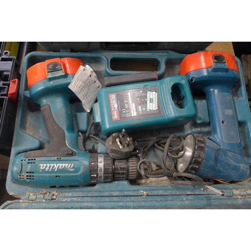 2117 - A selection of Makita power tools including an 83900 power drill, two flash lights, a 5704R 110v cir... 