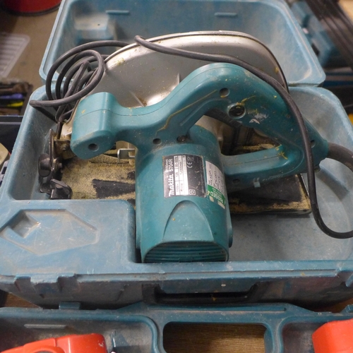 2117 - A selection of Makita power tools including an 83900 power drill, two flash lights, a 5704R 110v cir... 