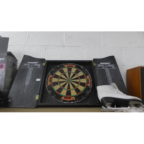 2124 - A Winmau dartboard in case, Dunlop holdall and pair of ice skates