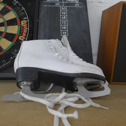 2124 - A Winmau dartboard in case, Dunlop holdall and pair of ice skates