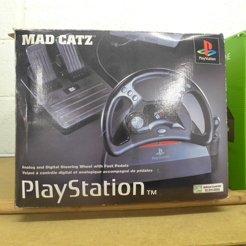 2127 - A Mad Catz Playstation Analogue and digital steering wheel with foot pedals in original box