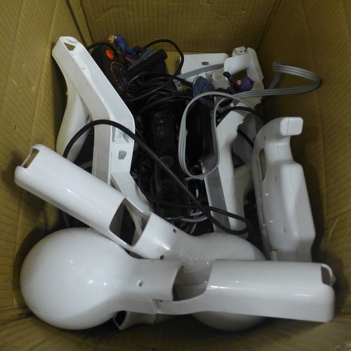 2134 - A box of Nintendo Wii consoles and accessories