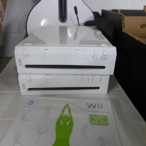 2134 - A box of Nintendo Wii consoles and accessories