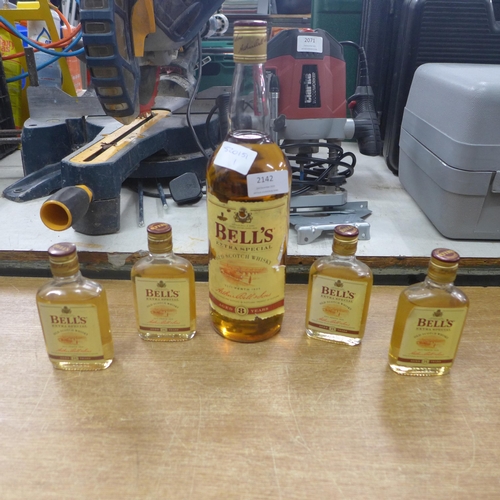 2142 - A litre bottle of Bells Whisky and four small bottles of Bells Whisky