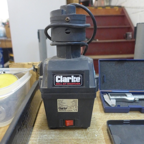 2174 - A box of misc; Clarke drill sharpener, burners, micrometers, etc.