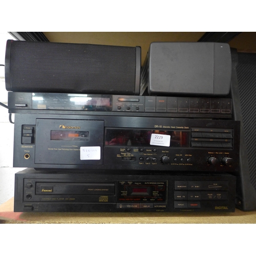 2229 - A Nakamichi discrete head cassette deck, a Sansui digital synthisiser (model:- TY-D33X) and a Sansui... 