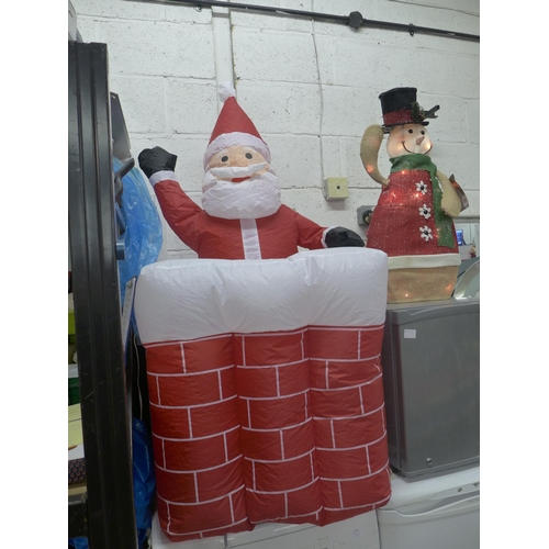 2255 - A Kingfisher inflatable animatronic Santa and light up animatronic snowman