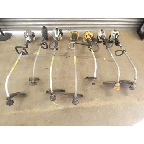 2305 - 7 Assorted petrol strimmers