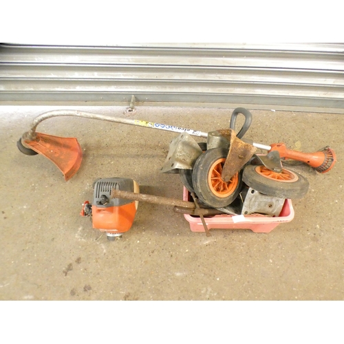 2307 - An Efco Stark 25TR grass cutter, a box of tools and misc. items