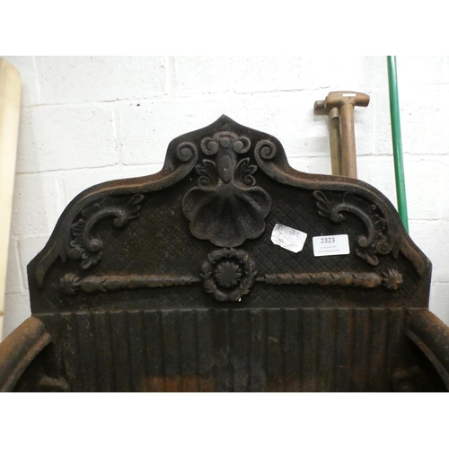 2323 - A cast metal fireplace