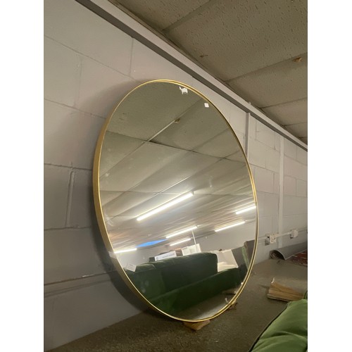 1401 - A large circular gold mirror