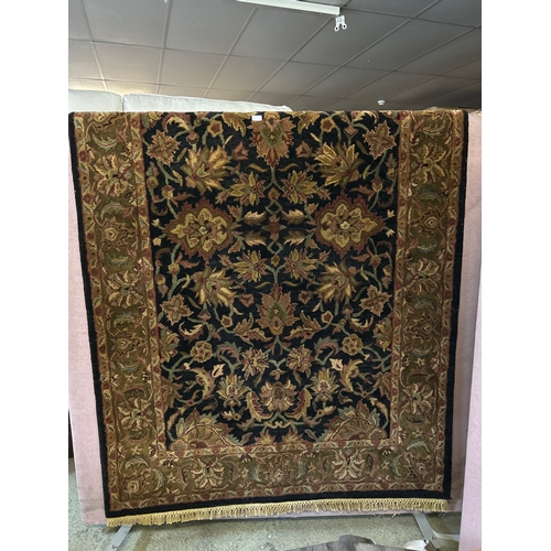 1522 - A 100% wool pile, Indian Agra rug, 8ft x 5ft