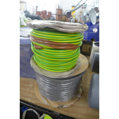 2411 - A roll of 50 25mm² mains tails and a roll of 16mm earth cable (50m partly used)