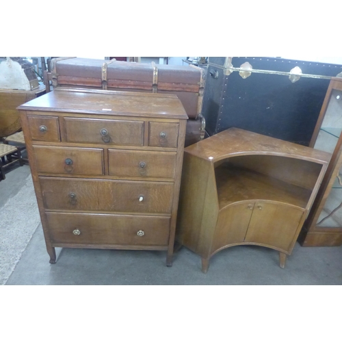 211 - An oak chest of drawers and a walnut corner cupboard