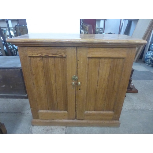 230 - A Victorian pitch pine fitted two door pantry cupboard