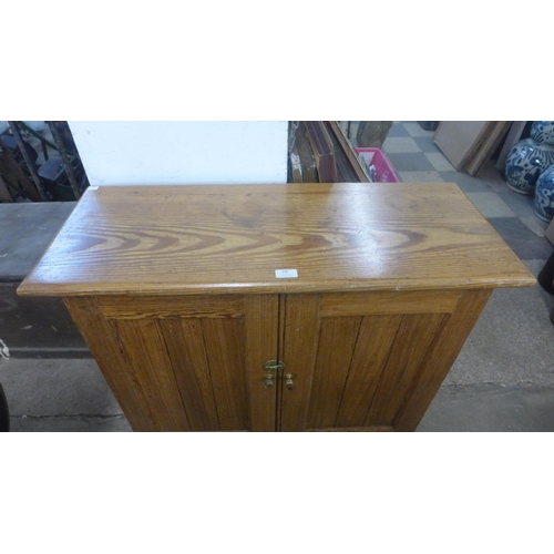 230 - A Victorian pitch pine fitted two door pantry cupboard