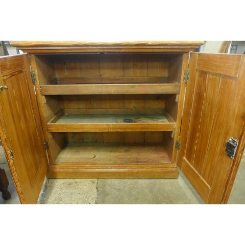 230 - A Victorian pitch pine fitted two door pantry cupboard