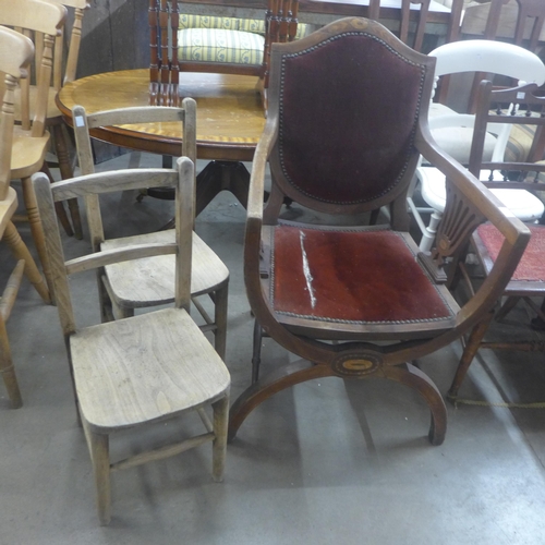 233 - An Edward VII inlaid mahogany x-frame armchair and a  pair of child's elm and beech chairs