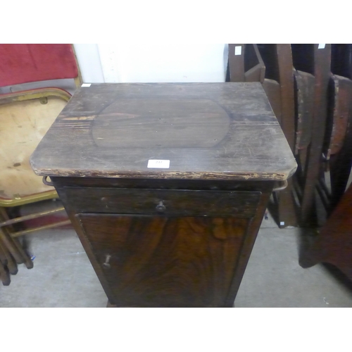 237 - A pine topped and faux wood metal single door cabinet