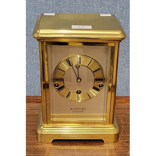 412 - A Rapport of London brass and four sided glass mantel clock