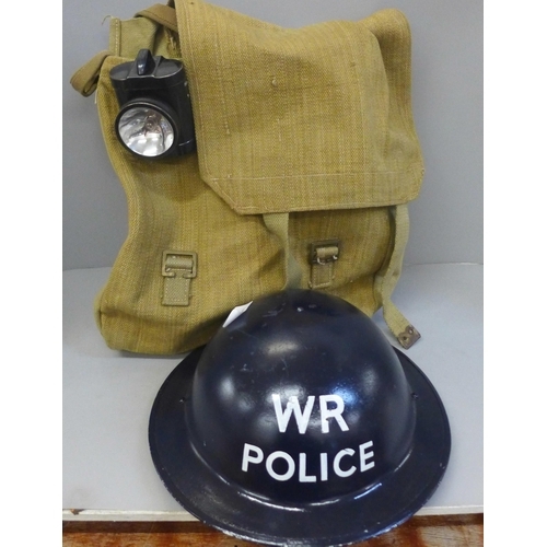 784 - A WR (War Reserve)  Police WWII helmet, gas mask bag, lamp, whistle and rucksack