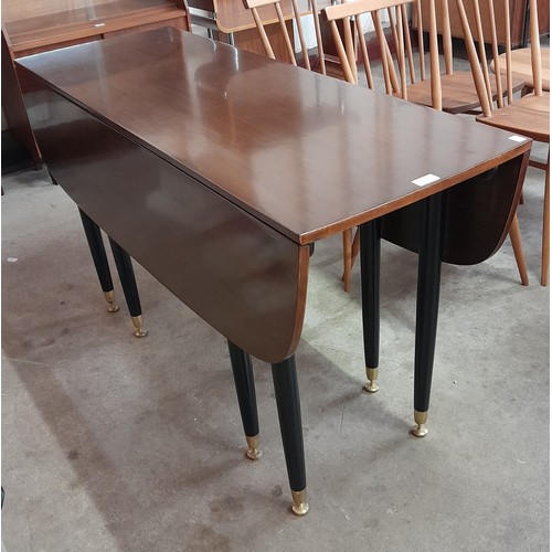 4 - A G-Plan Librenza tola wood and black drop-leaf table