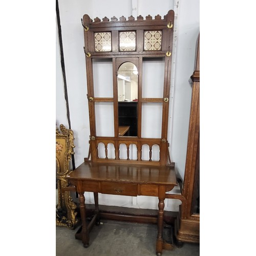 119 - A Victorian Aesthetic Movement oak and tiled back hallstand