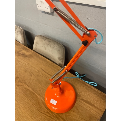1320 - An orange anglepoise lamp