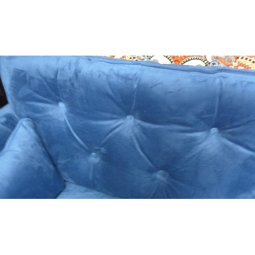 1329 - A blue velvet Hoxton three seater sofa - RRP £799