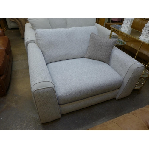 1385 - A textured weave light grey love seat
