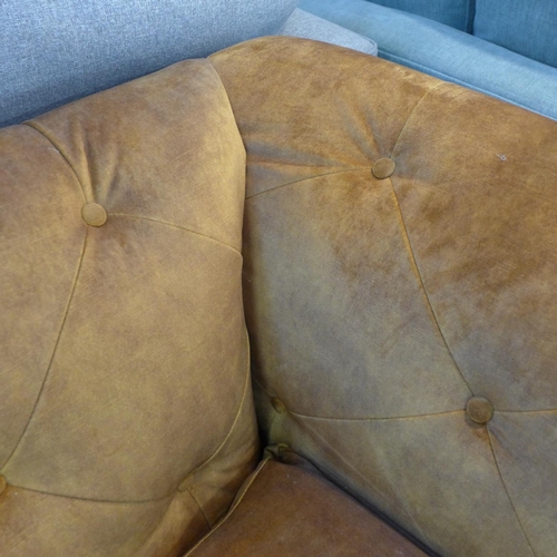 1373 - A Jaipur amber velvet button backed three seater sofa - RRP £1299