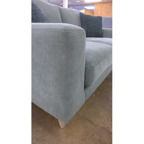 1437 - A sage fabric upholstered 2.5 seater sofa